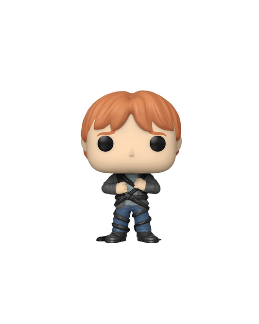 Figura Funko Pop de Ron Weasley (n.º 134) de Harry Potter, en su caja original con ventana transparente. La figura muestra a Ron con su característico atuendo de Hogwarts, incluyendo su túnica, bufanda de Gryffindor y varita, todo en estilo vinyl coleccionable visible a través del packaging.