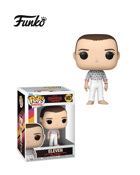 Figura Funko Pop de Eleven (n.º 1457) de Stranger Things temporada 4, en su caja original con ventana transparente. La figura muestra a Eleven con su característico uniforme blanco, cabello corto y expresión decidida, todo en estilo vinyl coleccionable visible a través del packaging.