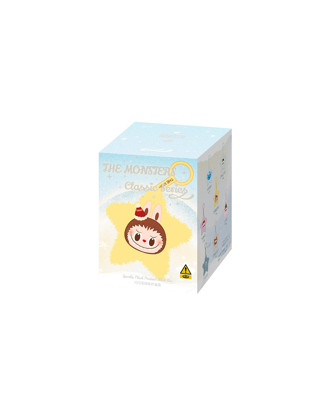 Caja blind box rectangular con diseño azul claro y un dibujo de estrella amarilla con la carita de Labubu; contiene un colgante‑peluche brillante en forma de estrella con cuerpo amarillo, cabeza redonda marrón, orejas de monstruo, pequeños cuernos y un lazo rojo encima.