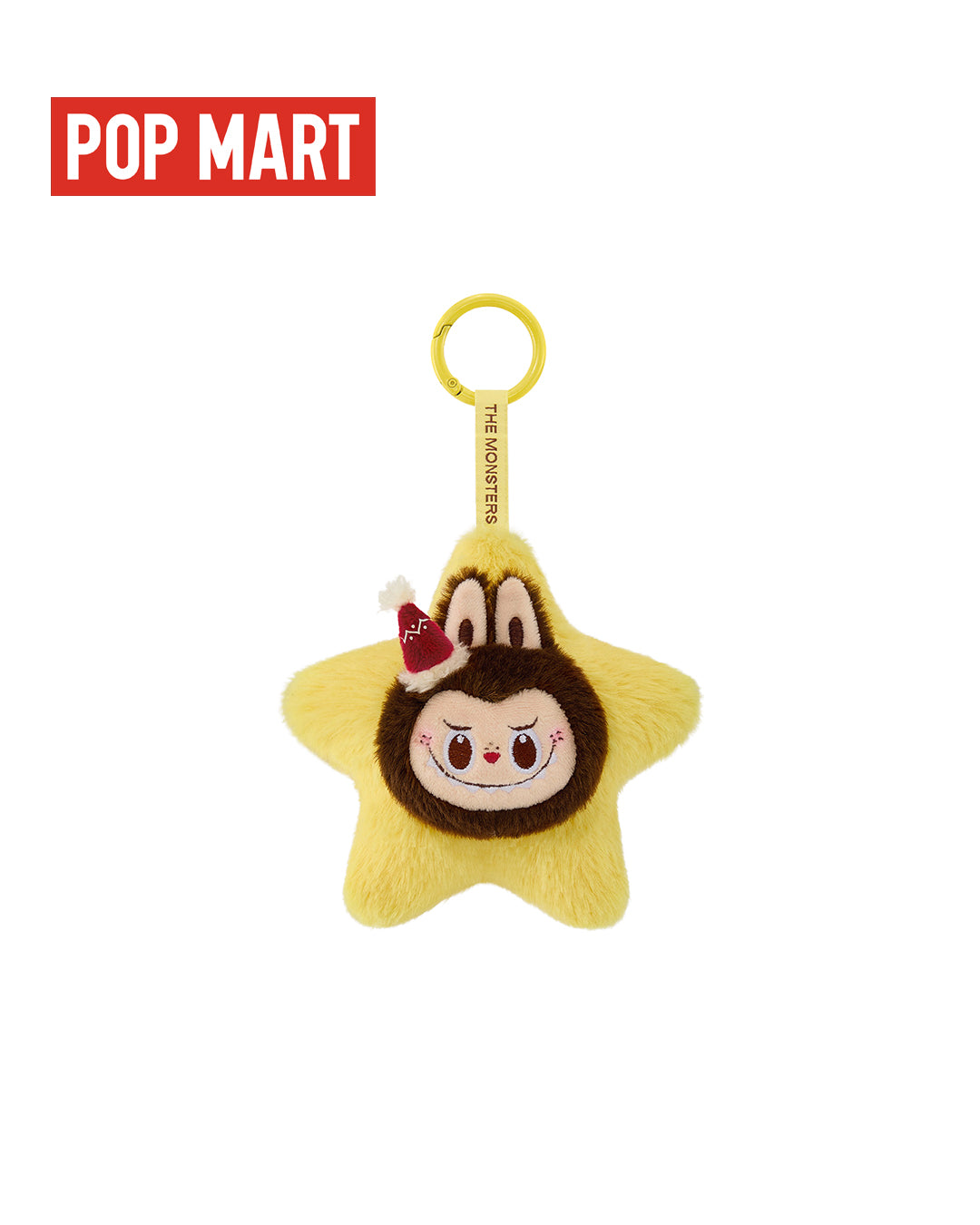 Llaverito (colgante de peluche brillante) de Labubu en forma de estrella amarilla con cara redonda marrón, orejas de monstruo y un pequeño lazo rojo en la cabeza.
