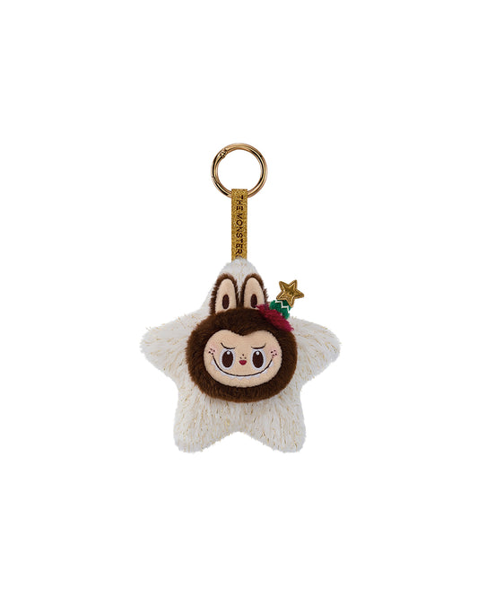 Figura secreta de Labubu sobre estrella blanca brillante con cuerpo marrón redondo, orejas monstruosas, cuernitos y gorro de árbol de Navidad verde; cuelga de una cinta/lazo con anilla.